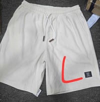 برمودات رجالي • ملابس