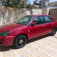لانسر موديل 9بسمي مصبوغة عام اثر جراد سياره جاهزه من كل نواحي فقط تبري...