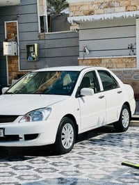 لانسر موديل 2010 رقم كربلاء دولي بسمي سنويه 28 سياره كامله بدون نقص مك...