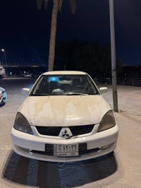اصدقائي ميتسوبيشي لانسر موديل 2007 السيارة جاهزة من كلشي شيء مابية اي ...