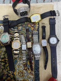 شلعه ساعات 9 قطع كلها بطاريه وبيها نسائي ورجالي سعرها 50 الف تطلع القط...