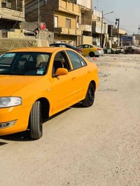 نيسان سني بدي كوري موديل 2010 سياره باسمي رقم كربلاء انكليزي مصفره هيئ...