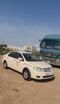 تەکسی کرۆلا 2005 ناوزەرد گێر عادی مەکینە بچوک پشتی لێدانی هەیە کەمێ بر...