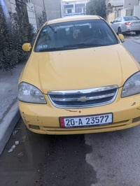 سيارة فورنزا موديل ٢٠٠٨ رقم ديالى انكليزي مصفره هيئة وغرامات باسمي سيا...