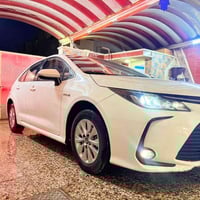 كورلا موديل 2021 هايبرد ياباني مو صيني  فول مواصفات عدا الفتحه  مكفولة...