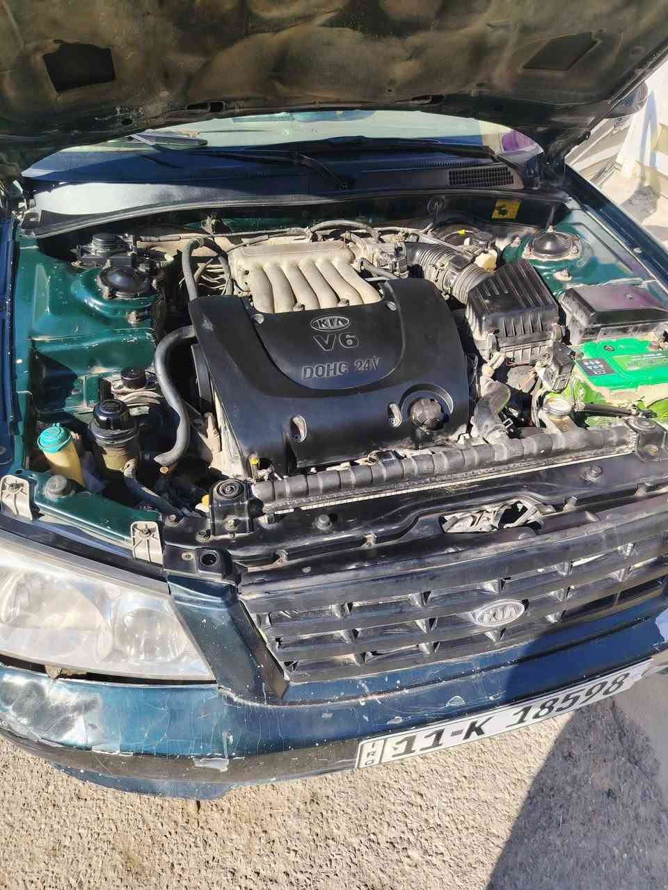 كيا اوبتما 2001 6 سلندر بيه نضام موفر بانزين يعني ماتصرف ابد  لسياره كلشي بيه شغال تبريد . كهربائيات . ريمون سنتر لك كير مكينه بلادي . بس لكشر مالته يرادله شويه ترتيب وتكحيل مصبوغه حزام فقط ومابيه اي ضربه بلاديه رايده ب60. لمكان بغداد لبياع .***********
