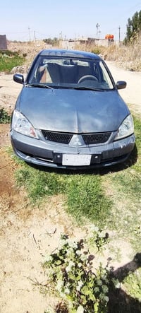 لانسر 2010 للبيع  السياره بيهه طخه بالجنطه ماعابره ابد كلش بسيطه  وبيه...