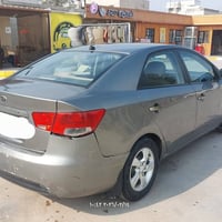 كيا سيراتو ٢٠١٢ خليجي رقم بغداد للبيع لون رصاصي غامق محرك ١٦٠٠ دوش ماش...