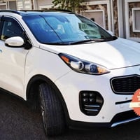 سبورتج EX • ابيض صدفي • ضرر جهة السائق