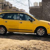 كيا رندو تكسي موديل 2012 رقم بغداد 5 راكب محرك 2400 ضررها جاملغ امامي ...