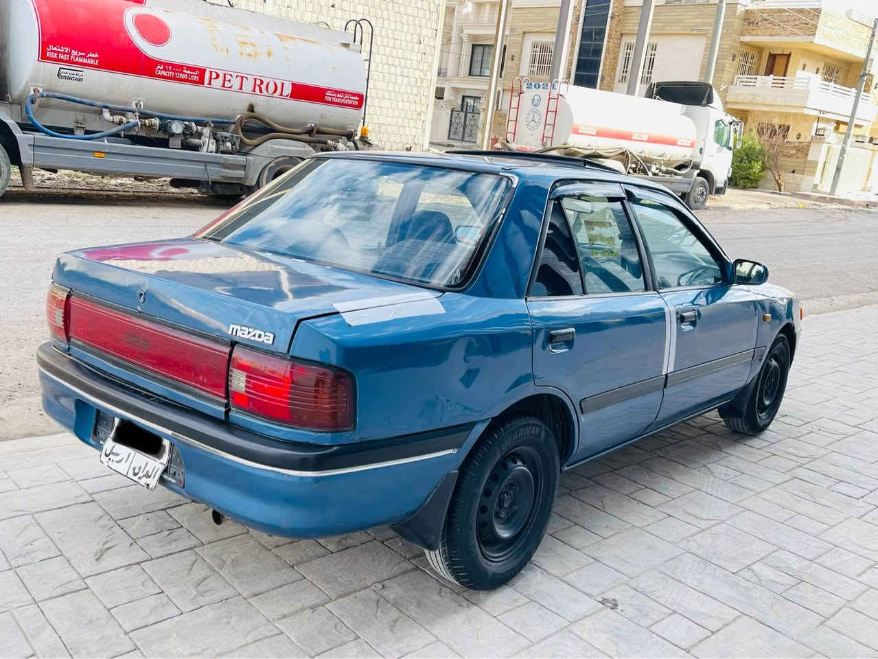 مازدا ٣٢٣ 
مۆدیل ١٩٩٢ 
گێڕ عادی پاوەرە مەکینە ١٦و بەخ مەڕغوب قفل مەرکەزیە..
گێڕ و مەکینە و برانەوە و وەڕگەڕانی بەشەرت 
سبوغ عام بۆ جوانی پێشی هیچی نیە پشتی جەمپی خەفیفی هەیە.. ٤ تایەی نوێیە نەقسی
نیە سەیارەکە...کارەبایی و گەرمی و گێچی هەمووی ئیش دەکا
بەناو کردن بەشەرت فەحس و هەزەی کرایە...
١٣٠،٠٠٠ سەد و سی هەزار غڕامەی لەسەرە 
*********** لە هەولێرم أربيل, العراق
