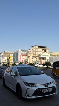 كورلا ساز هايبرد ( ساز ) وليس صيني  السياره بعدهة داخل الضمان شركه ساز...