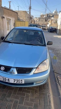 لانسر ٢٠٠٥ مشروع وطني سياره جاهزه بيهة ضربه بدون داخل جاملغ خلف الصدر ...