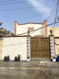 النجف حي المكرمه • ١٠٠م • تقسيط ١٨سنة