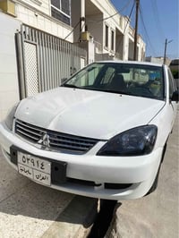 لانسر ٢٠٠٧ • أبيض أصلي • رقم سليمانية