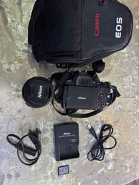 نيكون ٥٢٠٠ • نضافة ٩٥٪ • مع جنطه