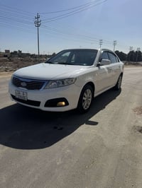 كيا اوبتيما 2010 خليجيه مكفوله فقط بل داير الخلفي رشه بسيطه رقم بصره د...