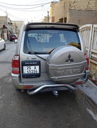 باجيرو موديل 2003 رقم كركوك انكليزي بااسمي مصبوغه حزام جماليه وبيهه طخ...