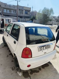 كيو كيو 2013 كير عادي مكفوله سياره نضيفه السعر 27 مكاني بغداد 07717548...