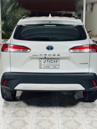 07901402719كورولا كروز ساز موديل 2022 رقم بغداد ابيض داخل ماروني هايبر...