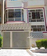 دار للإيجار مساحة 100 متر واجهه 7.5 متر كرادة خارج خلف شارع العطار الب...