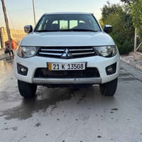 ميتسوبيشي 4X4 L200 موديل ٢٠١٣ كاز (ديزل) ماشية ١٨٤ كم  السيارة نظيفة ج...