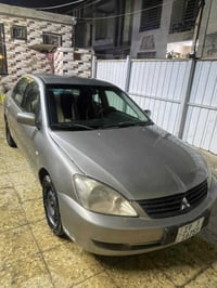 لانسر موديل 2010 تخم تاير تبريد ثلج السياره مصبوغه حزام مابيه اي نقص ا...