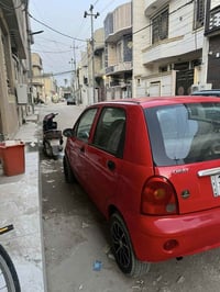 كيو كيو2012 حمراء للبيع كير عادي للاستفسار07758978908 السعر28وبيه مجال