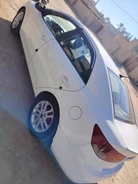 كيا سيراتو موديل 2011 وارد خليجي رقم بغداد انكليزي مصبوغه حزام  بدون د...