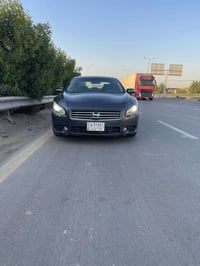 نيسان مكسما موديل 2012 مكينة 6 سلندر ماشية 104 الف حقيقي شرط بس بانزين...