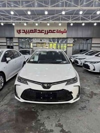 كورلا هايبرد شكل خليجي   2025   فتحه سقف   داخل جلد اصلي (لون اسود )  ...