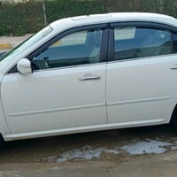 اوبتيما ٢٠١٠ • أبيض • رقم بغداد