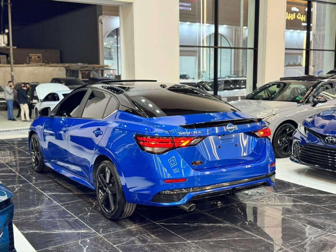 𝟐𝟎𝟐𝟒 𝐍𝐈𝐒𝐒𝐀𝐍 𝐒𝐍𝐓𝐑𝐀-𝐒𝐑.𝐏𝐋𝐔𝐒

نيسان سنترا (𝐒𝐑.𝐏𝐋𝐔𝐒) موديل : 2024

اللون :ازرق مميز سقف اسود بيلادي

عداد المسافة : 674 زيـــرو

حجم المحرك : 2.0L (4.سلندر)

ملاحظة السيارة : فقط ربع جاملغ صبغ بدون دواخل 

كافة الايرباكات سليمة 100%

المواصفات : 𝐒𝐑.𝐏𝐋𝐔𝐒

فول فول مواصفات 1/1

فتحة سقف سلايد 
 بصمة ابواب 
بصمة تشغيل 
تشغيل عن بعد (𝐑𝐄𝐌𝐎𝐓𝐄 𝐒𝐓𝐀𝐑𝐓)
سستم سماعات 🔊 (𝐁𝐎𝐒𝐄)
شاشة دشبول ديجيتال
شحن وايرليس
كاميرا °360
‏‎كاميرا امامي
كاميرا جانبي
كاميرا خلفي
اوتو ستارات (𝐀𝐔𝐓𝐎 𝐒𝐓𝐀𝐑𝐓)
اوتو ستوب (𝐀𝐔𝐓𝐎 𝐒𝐓𝐎𝐏)
رادار امامي (تحديد مسار)
رادار جانبي  (نقاط عمياء)
رادار خلفي (التحذير من الاصطدام)
حساسات امامي
حساسات جانبي 
حساسات خلفي 
نظام (𝐄𝐂𝐎)
نظام (𝐍𝐎𝐑𝐌𝐀𝐋)
نظام (𝐒𝐏𝐎𝐑𝐓)
كشنات جلد
كشنات كهربائي
كشنات هيتر
تحكمات استيرن
استيرن هيتر
تبريد لمس 
تبريد مركزي 
لايتات ليـــLEDـــد عدسة زينون بيلادي
بكلايتات ايـــLEDـــد بيلادي
ويــــل كــــروم  

بعد هواية مواصفات…

‏‎تفاصيل اكثر الاتصال علی ارقام التاليه ‏

☎️***********

☎️***********

‏‎عنوان📍اربيل فرع ناقلات

معرض كاليفورنيا كارس CALIFORNIA Cars أربيل, العراق
