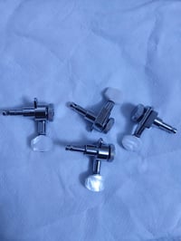 قفل أوتار • كيتار كهربائي • مجموعة