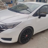 نيسان فيرسا 2024 فئة SR فول ماشية ١٩ الاف ميل  مكينه 1.6L  رقم بغداد ت...