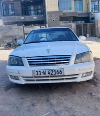 اوبتما • ٢٠٠١ • بابل الاسكندرية