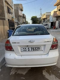 شيفروليه أفيو موديل 2011 خليجي 🇰🇼 لون أبيض  المكينة وكير بحالة جيدة جد...