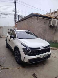 كية سبورتج 2024 مكفولة كفالة عامة  فول مواصفات. هايبرد لون ابيض بصمة ك...