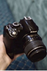 نيكون D3100 • شاحن وبطارية • نجف