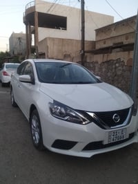 نيسان سنترا صيني ٢٠٢٤ ماشية ١٨ ألف بيها جامرلج سايق أمامي صبغ رقم سليم...