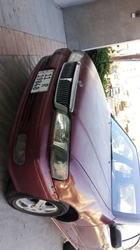 للبيع سيارة نوع نيسان سني موديل 2000 اللون احمر رقم بغداد الجديد سنوية...