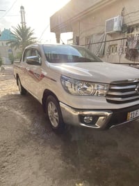 تويوتا هايلوكس للبيع  الموديل ٢٠٢٥  ماشيه ٥٠ الف  رقم بغداد الدولي  مو...