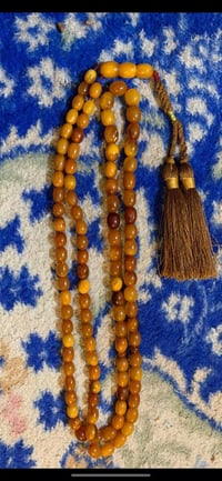 مسباح كهرب الاماني  كل خرزه مكفوله شرط الوزن 35غرام  عدد الحبات 101مكا...