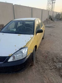لانسر موديل 2010 ليموني للبيع  محركها كايم التيارات الخلفيه تعبانات صد...