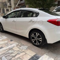 كيا سيراتو خليجي ابيض بأسمي تحويل مباشر رقم بغداد الدولي محرك 2000 دوش...