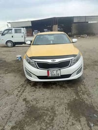 …  كـيا اوبتما للبيع موديل 2014 سياره بيها باب السايق مبدل وحادثه خلفي...