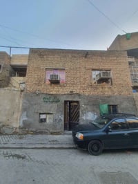 بيت للبيع بناء قديم طابقين مدينة الصدر قطاع ٥٠ السعر ١٤٥ /07709272887