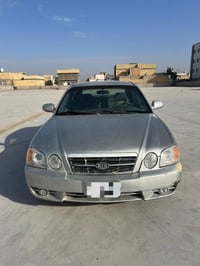 اوبتيما • 2004 • قير ومحرك جديد