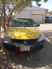 لانسر 2010 وراد امريكي تبريد ثلج  تخم تاير حداديه حادثها جاملغ خلفي مك...