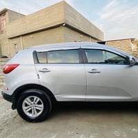 كيا سبورتج 2011  محرك 2000  السياره نضيف مال بيت  ضررها جاملغ وشويه بل...